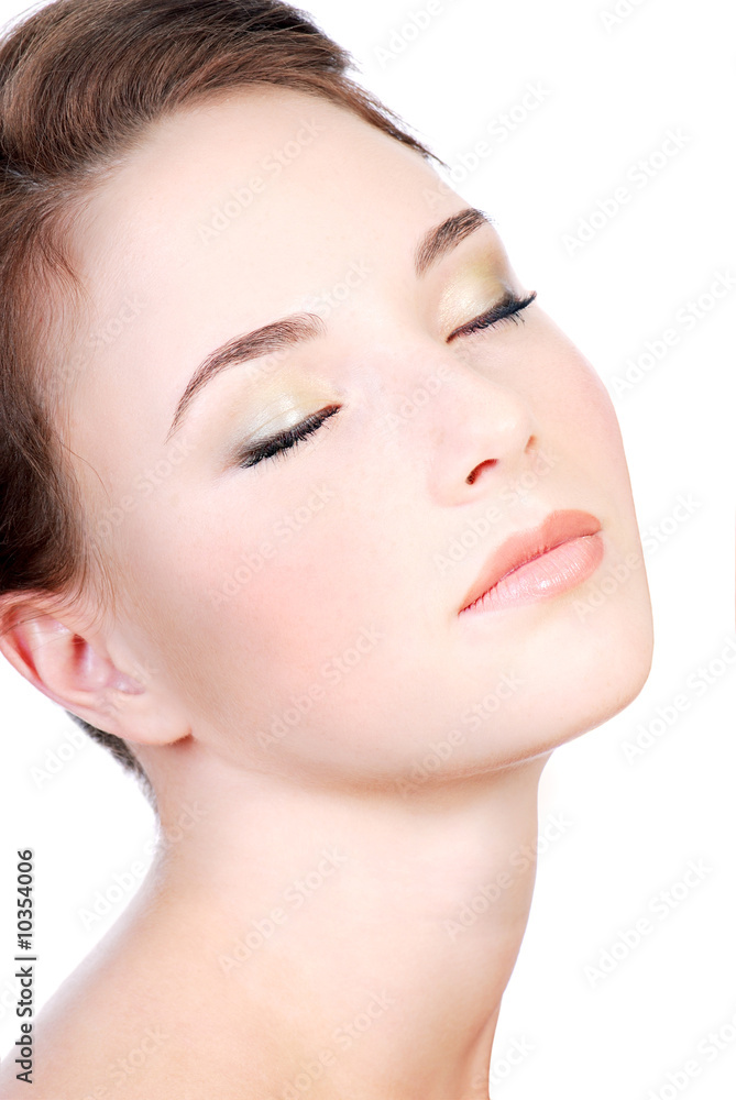 Young woman face close-up with closed eyes, Relaxation concept.
