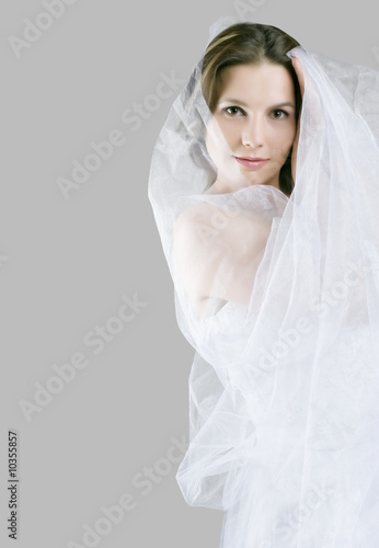 Close-up of beautiful bride in white dress