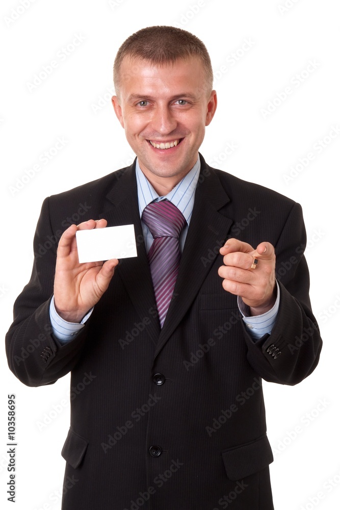 smiling young businessman holding a blank business card smiling young businessman holding a blank business card
