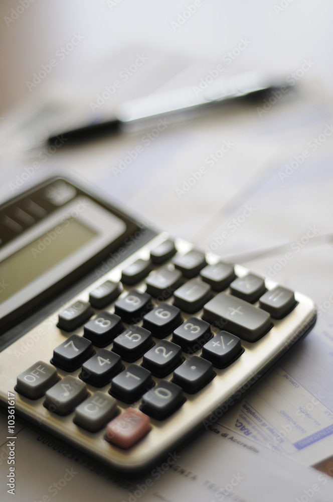 calculator and paper with pen calculator and paper with pen
