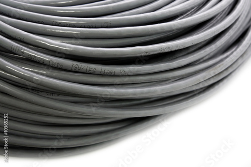Hank of a grey network cable on a white background