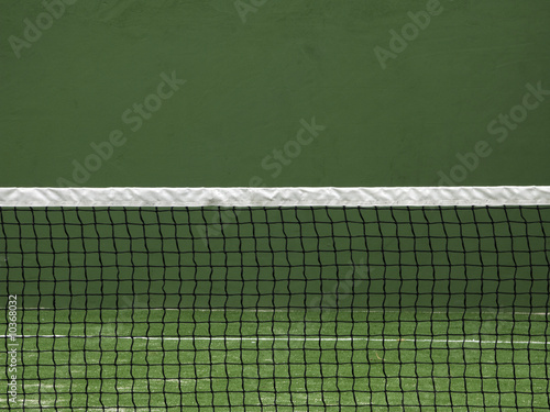 Net of paddle court on green wall background.