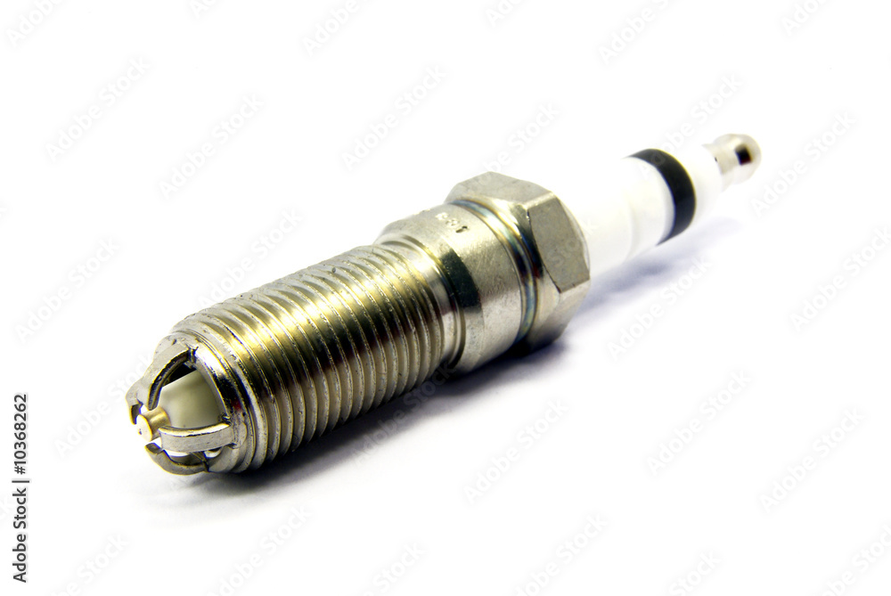Detail view of an engine spark plugs over white background. Detail view of an engine spark plugs over white background.