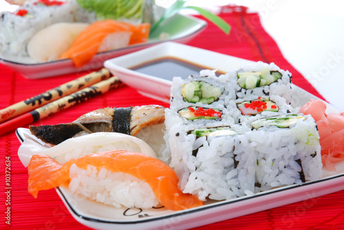 Set of rolls and sushi on several plates
