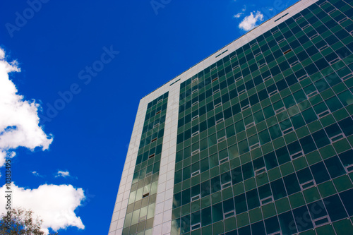 Skyscrapper and blue sky with clouds