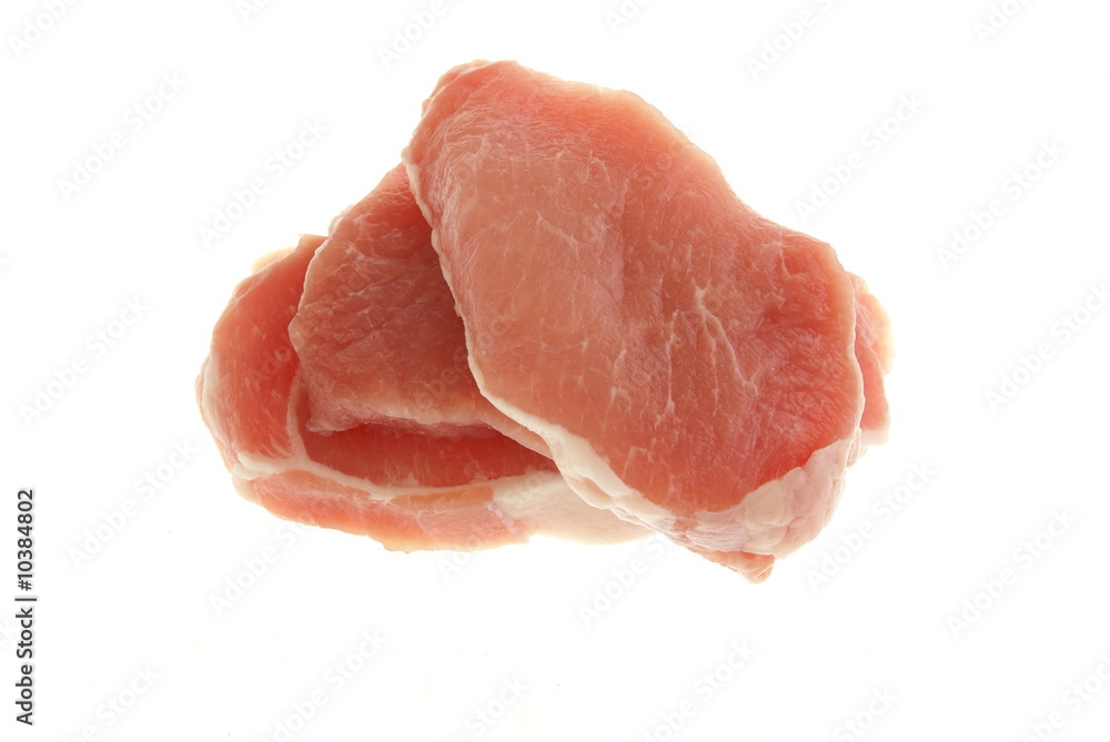 Three boneless pork chops or pork steaks on a white background