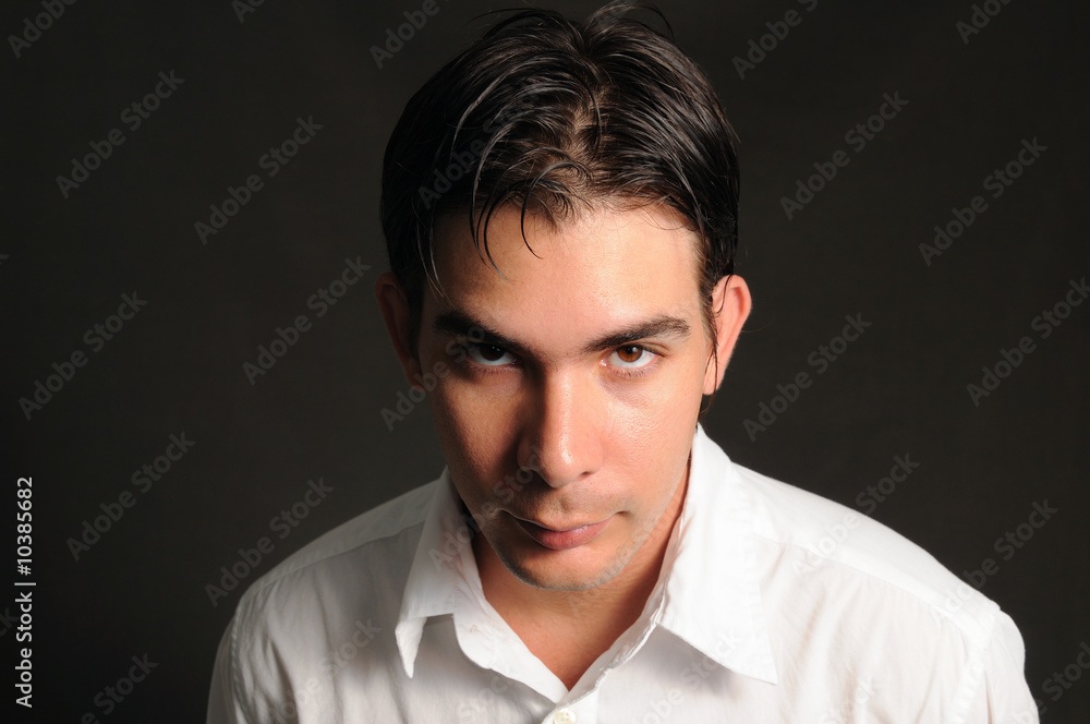 Portrait of young man with intense look Portrait of young man with intense look