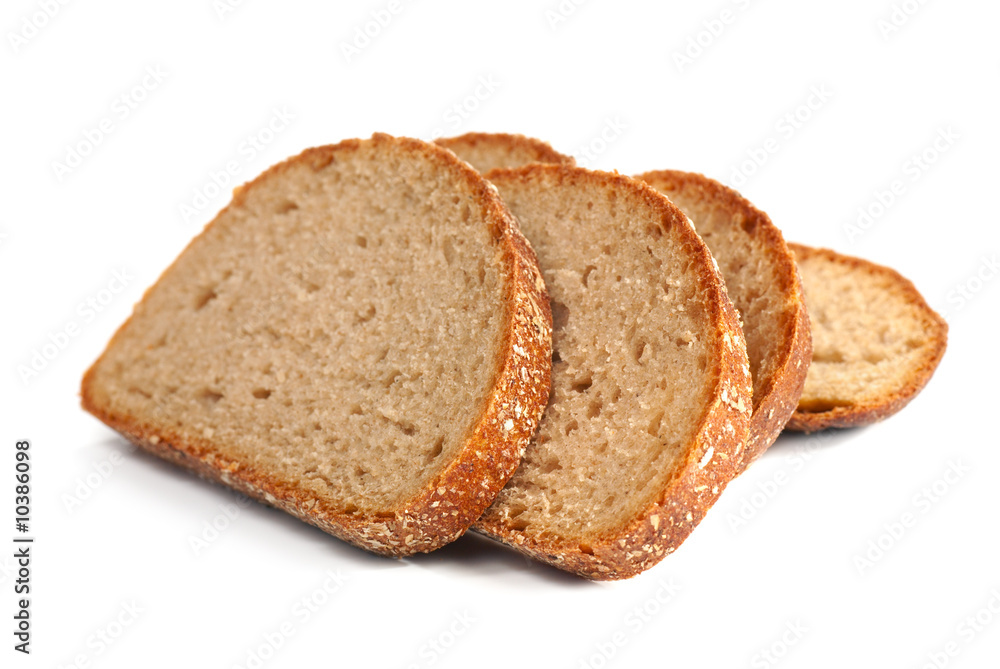 slices of whole wheat bread on light background slices of whole wheat bread on light background