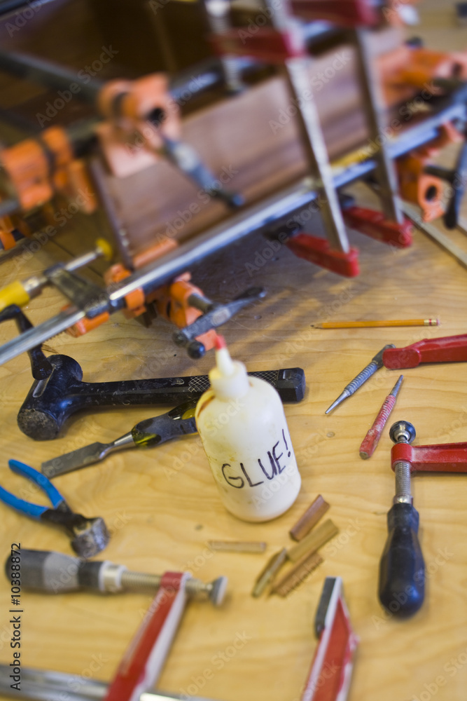 Wood working tools and glue used to repair a broken drawer. Wood working tools and glue used to repair a broken drawer.