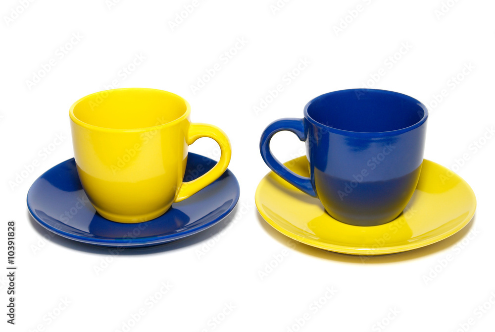 Two colored teacups isolated on white. Two colored teacups isolated on white.
