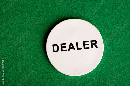 A dealer chip, part of a home poker game
