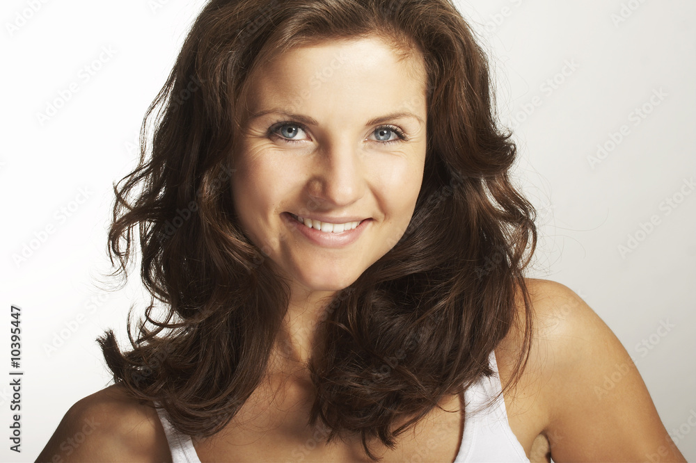 A happy young woman with facial expression on white background A happy young woman with facial expression on white background