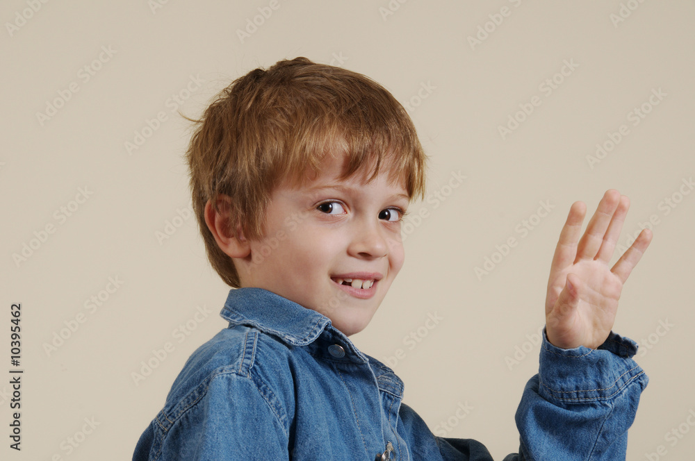 Young caucasian smiling boy in blue shirt Young caucasian smiling boy in blue shirt
