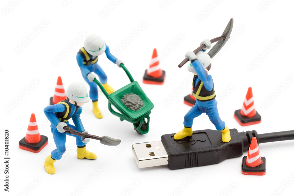 computer repair concept - usb cable repaired by workers isolated computer repair concept - usb cable repaired by workers isolated