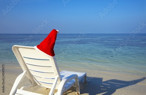 Armchair are waiting you on a white sandy beach