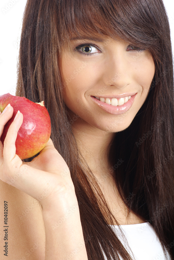 Beautiful young woman eating a red apple. Isolated over white Beautiful young woman eating a red apple. Isolated over white