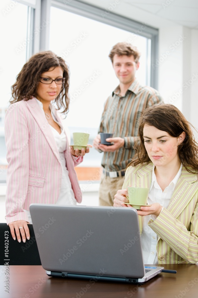 Team of young successful office workers talking Team of young successful office workers talking