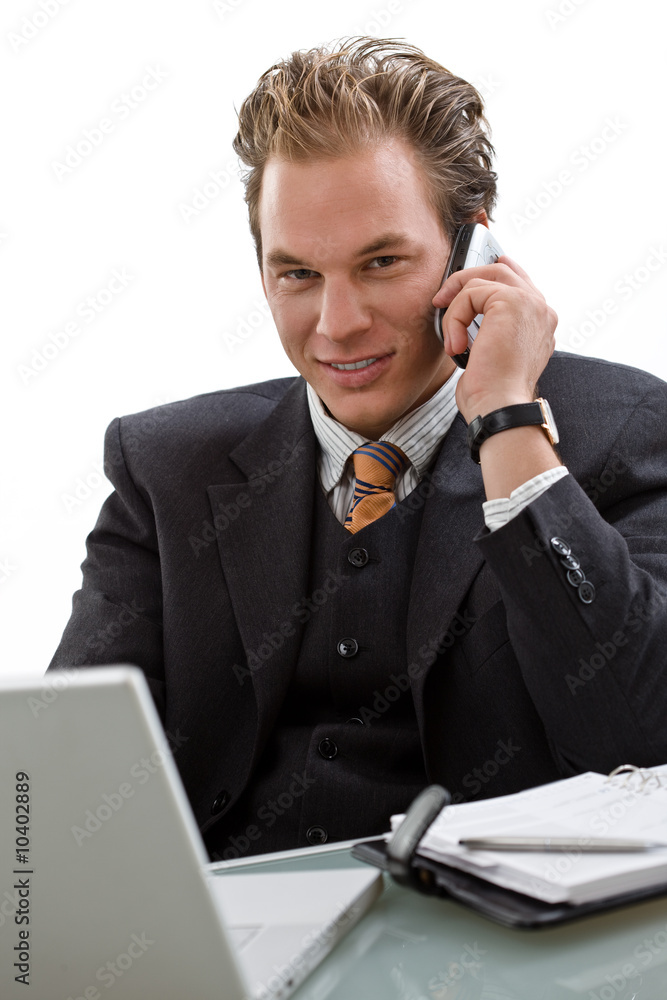 Businessman using laptop computer, mobile phone, Businessman using laptop computer, mobile phone,