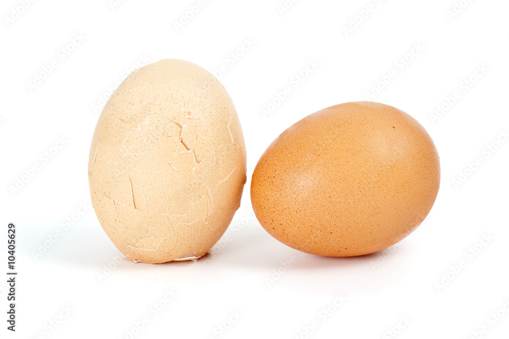 Whole and cracked eggs isolated on the white background Whole and cracked eggs isolated on the white background