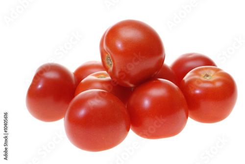 arranged red tomatoes isolated on white background