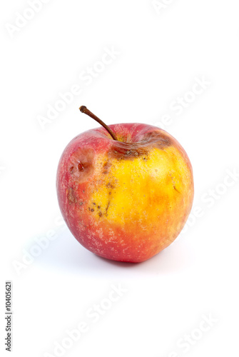 Slightly rotten apple isolated on the white background