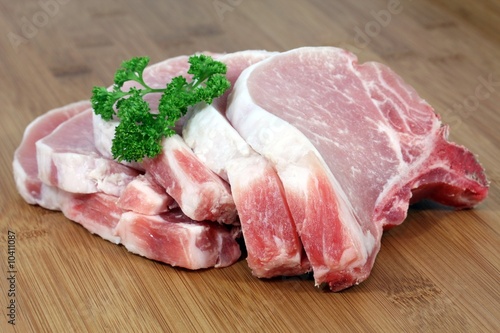 Prepared slices of fresh pork meat with parsley