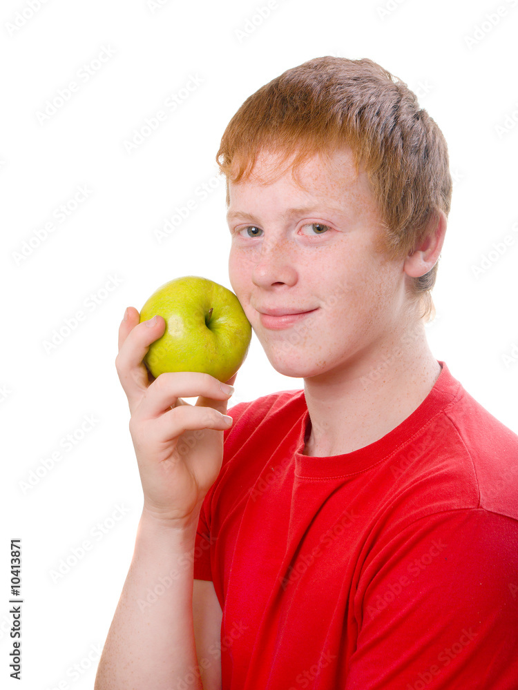 redhead teenager Caucasian wit green apple smiles redhead teenager Caucasian wit green apple smiles