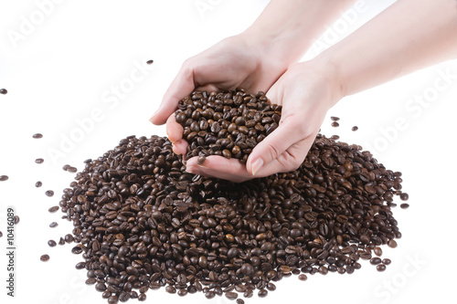 Woman s hands and coffee beans
