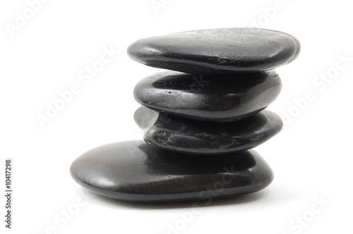 black stones in balance isolated on white background