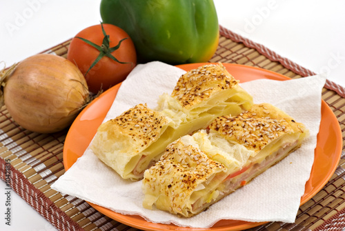 Salty ham strudel with sesame,cheese and vegetables