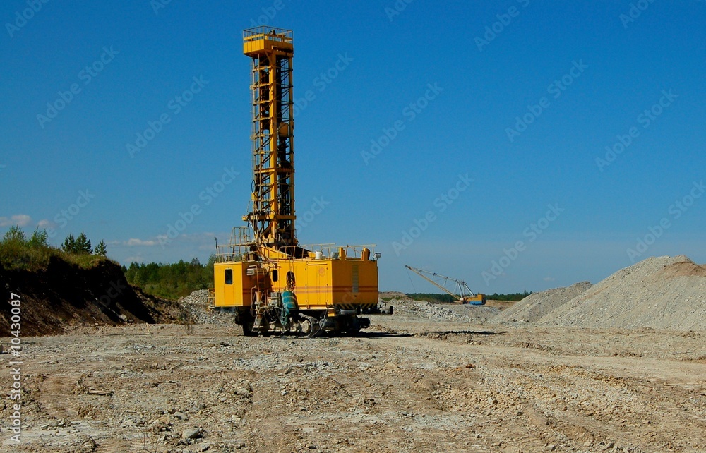 Drillihg machine in open cast mining quarry Drillihg machine in open cast mining quarry