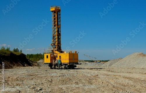 Drillihg machine in open cast mining quarry