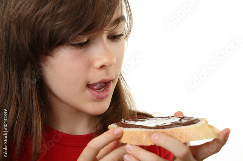 Girl eating bread with peanut butter
