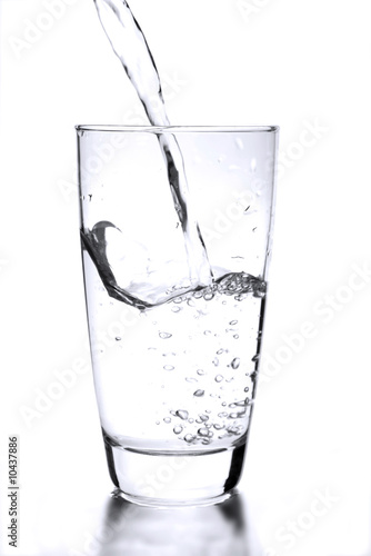 a simple glass of water on white