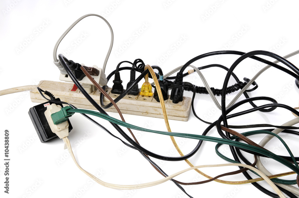 Dirty old power strip overloaded with too many cords Dirty old power strip overloaded with too many cords