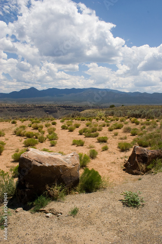 large boulders dot an otherwise desert landscape
