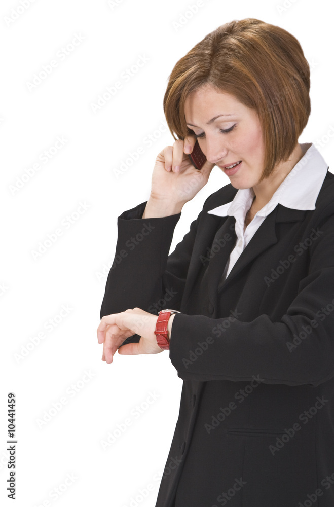 Busy businesswoman checking the time while calling. Busy businesswoman checking the time while calling.