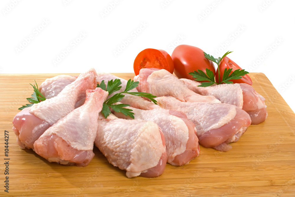 Fresh raw chicken wings on chopping board Fresh raw chicken wings on chopping board