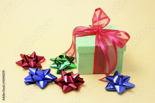 Gift Box and Bows on Yellow Background