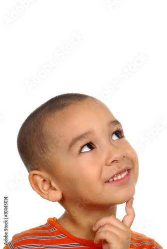 5-year-old hispanic boy looking up in wonder