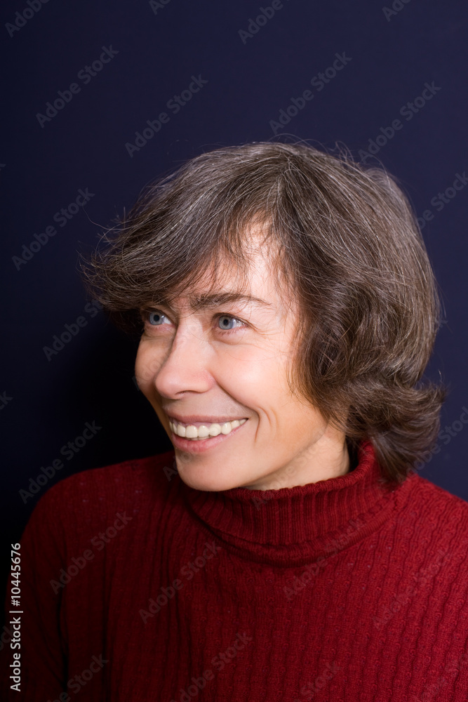 Portrait of brown-haired smiling woman on balck background Portrait of brown-haired smiling woman on balck background