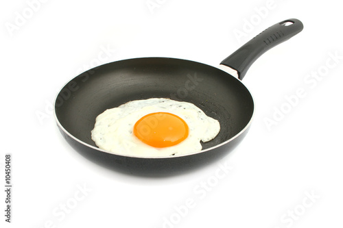 egg in pan isolated on white