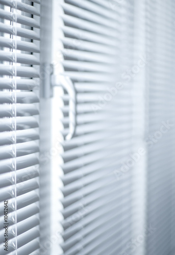 Room decoration with plastic sunblinds close up.