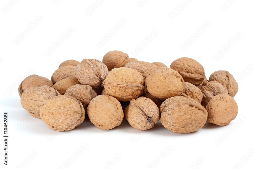 Pile of walnuts isolated on the white background Pile of walnuts isolated on the white background
