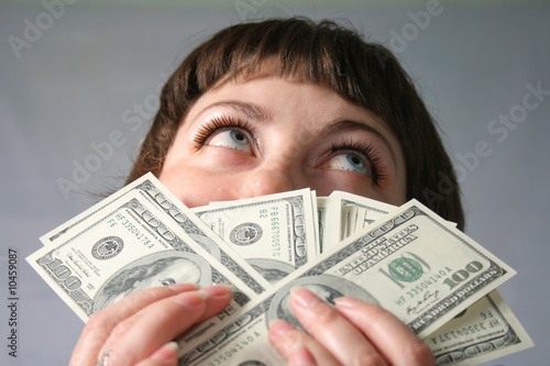 Woman with hand of money photo