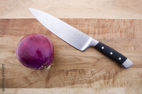 Onion and Knife on Cutting Board