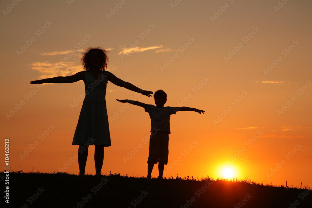 Fototapeta premium Mother and son on sunset stretching