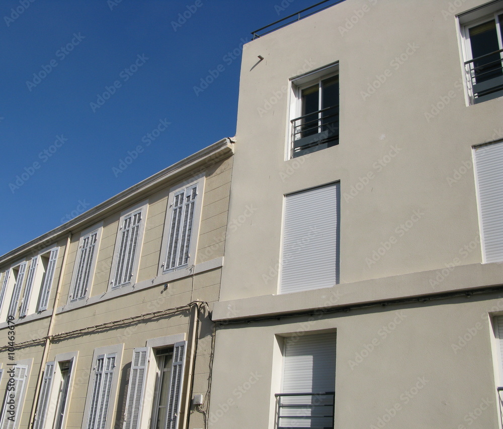 Façades claires, rue de Marseille, Paris.