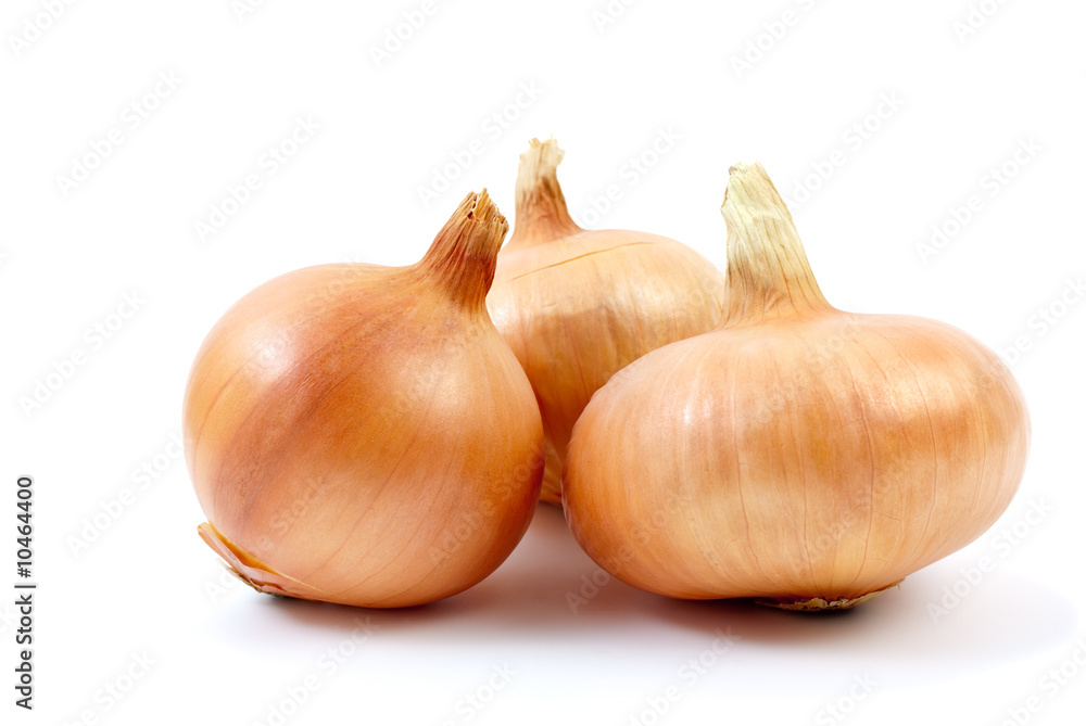 Three onions isolated on the white background