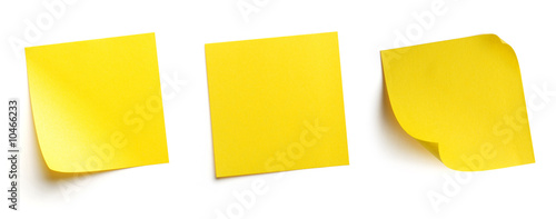 Yellow blank post-it notes isolated on white